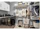 Well-organized laundry room with modern washer and dryer, storage cabinets, and practical shelving at 2837 Bayshore Trails Dr, Tampa, FL 33611