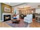 Cozy living room with a fireplace, hardwood floors, and elegant decor at 2837 Bayshore Trails Dr, Tampa, FL 33611
