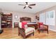 Serene main bedroom with hardwood floors, plantation shutters, and stylish furnishings at 2837 Bayshore Trails Dr, Tampa, FL 33611