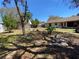 View of the backyard featuring a spacious lawn, various plants, and patio furniture at 3257 Bluestone Ave, Spring Hill, FL 34609