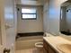 Bathroom featuring a shower-tub combo, tile, and neutral color at 3257 Bluestone Ave, Spring Hill, FL 34609