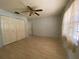 Spacious bedroom featuring a ceiling fan and ample closet space at 3257 Bluestone Ave, Spring Hill, FL 34609