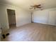 Large bedroom with light-colored walls, wood floors, and a ceiling fan at 3257 Bluestone Ave, Spring Hill, FL 34609