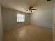 Bedroom with wooden floors, neutral walls, and a ceiling fan at 3257 Bluestone Ave, Spring Hill, FL 34609