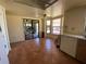 View of a kitchen with tile floors, white appliances, and wood cabinets at 3257 Bluestone Ave, Spring Hill, FL 34609