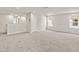 Spacious bonus room with soft carpet, neutral walls, and bright windows at 3467 Timber Crossing Ave, Brandon, FL 33511