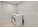 Modern laundry room with a new washer and dryer at 3467 Timber Crossing Ave, Brandon, FL 33511