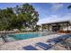Beautiful community pool with lounge chairs and a covered patio area at 3467 Timber Crossing Ave, Brandon, FL 33511