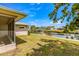 Scenic backyard with canal access, features a lush lawn and a private dock for waterfront enjoyment at 4061 13Th Ne Ln, St Petersburg, FL 33703