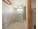 Bathroom featuring a bathtub, window, and updated lighting at 4061 13Th Ne Ln, St Petersburg, FL 33703