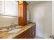 Elegant bathroom features a dual sink vanity with granite countertops and decorative wood cabinets at 4061 13Th Ne Ln, St Petersburg, FL 33703