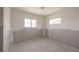 Bright bedroom featuring a window and updated lighting ready for renovation at 4061 13Th Ne Ln, St Petersburg, FL 33703