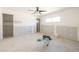 Bright bedroom featuring a ceiling fan, closet, and window ready for renovation at 4061 13Th Ne Ln, St Petersburg, FL 33703