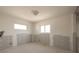 Bright bedroom featuring a window and updated lighting ready for renovation at 4061 13Th Ne Ln, St Petersburg, FL 33703