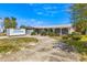 Charming single-story home featuring stone accents, a covered porch and well-maintained landscaping at 4061 13Th Ne Ln, St Petersburg, FL 33703