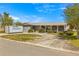 Charming single-story home featuring stone accents, a covered porch and well-maintained landscaping at 4061 13Th Ne Ln, St Petersburg, FL 33703