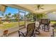 Screened-in patio with comfortable seating, overlooking the backyard and the tranquil canal at 4061 13Th Ne Ln, St Petersburg, FL 33703