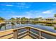Waterfront view from wood dock showcasing boats, canal access, and beautiful blue sky at 4061 13Th Ne Ln, St Petersburg, FL 33703