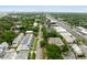 Wide aerial shot showcases modern townhomes with nearby commercial avenues and distant skylines at 4515 W North A St # 4, Tampa, FL 33609