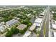 An aerial shot of modern townhomes in a green urban landscape, near a commercial area at 4515 W North A St # 4, Tampa, FL 33609