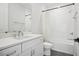 Bright bathroom with white vanity, quartz countertop, and tiled shower-tub combo at 4515 W North A St # 4, Tampa, FL 33609