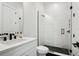 Modern bathroom featuring a frameless shower with geometric tile and black fixtures at 4515 W North A St # 4, Tampa, FL 33609