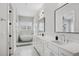 Spacious white bathroom with double vanity, soaking tub, and marble accents at 4515 W North A St # 4, Tampa, FL 33609
