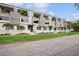 Modern townhome row with balconies, clean landscaping, and new construction appeal set in a tropical area at 4515 W North A St # 4, Tampa, FL 33609