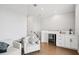 Modern living area featuring a wet bar, hardwood floors, and white armchairs at 4515 W North A St # 4, Tampa, FL 33609