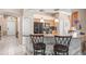 Spacious kitchen featuring modern appliances, granite countertops, and a convenient breakfast bar at 4517 Havelocke Dr, Land O Lakes, FL 34638