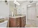 This bathroom features brown cabinets and a granite countertop at 4555 Debbie Ln, Lutz, FL 33559