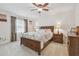 This bedroom offers a well-lit room with modern decor at 4555 Debbie Ln, Lutz, FL 33559