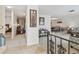 Bright foyer showcasing travertine tile flooring, neutral walls, and stairway with wrought iron railing at 4555 Debbie Ln, Lutz, FL 33559