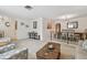 Bright living area featuring neutral carpet, comfortable seating, an open dining area, and easy access to other rooms at 4555 Debbie Ln, Lutz, FL 33559