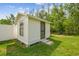 Charming backyard shed, perfect for storage or a workshop, set in a well-maintained yard at 4555 Debbie Ln, Lutz, FL 33559