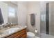 Bright bathroom with granite countertop, updated vanity and a glass-enclosed shower with designer tile at 47 Martinique Ave, Tampa, FL 33606