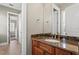 Bathroom featuring granite countertop with sink, modern faucet fixture, and neutral wall color at 47 Martinique Ave, Tampa, FL 33606