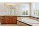 Bathroom features a soaking tub with tile, dual vanities with granite countertops, and bright natural light at 47 Martinique Ave, Tampa, FL 33606