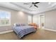 Cozy bedroom with plush carpet, natural light and an ensuite bathroom at 47 Martinique Ave, Tampa, FL 33606