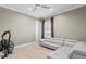 Multi-purpose bonus room with a neutral color scheme, a stylish sofa, and workout equipment at 47 Martinique Ave, Tampa, FL 33606