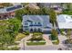 Beautiful aerial view of a two-story home with manicured landscaping, brick driveway, and attached garage at 47 Martinique Ave, Tampa, FL 33606