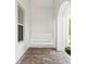 Front porch with a hanging porch swing, brick flooring, and white wood exterior at 47 Martinique Ave, Tampa, FL 33606