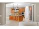 Spacious kitchen with wooden cabinets, granite counters, and stainless steel appliances at 47 Martinique Ave, Tampa, FL 33606