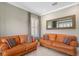 Living room with neutral tile flooring and designer sofas with patterned pillows at 47 Martinique Ave, Tampa, FL 33606