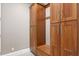 Spacious mudroom with custom wood cabinets, seating, and ample storage for an organized entryway at 47 Martinique Ave, Tampa, FL 33606