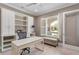 Bright office with built-in shelving, a comfortable desk, and a window seat overlooking the landscaped yard at 47 Martinique Ave, Tampa, FL 33606