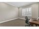 Bright carpeted office features a large window with shutters and a work desk at 47 Martinique Ave, Tampa, FL 33606