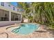 Inviting backyard pool and spa surrounded by lush tropical landscaping, perfect for entertaining at 47 Martinique Ave, Tampa, FL 33606
