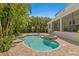 Beautiful backyard pool and spa area, complete with brick pavers and tropical landscaping for privacy at 47 Martinique Ave, Tampa, FL 33606