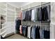 Large walk-in closet featuring ample shelving, drawers, and hanging space for clothing and accessories at 47 Martinique Ave, Tampa, FL 33606